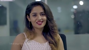A Young And Attractive Woman Assists A Filmmaker In A Tamil-Language Production, Showcasing Her Impressive Curves And Youthful Allure