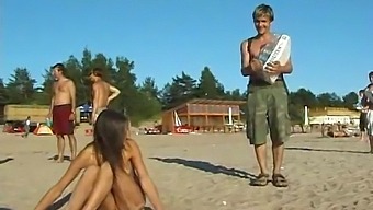 A Stunning Young Girl Disrobes And Enjoys Herself At The Seaside